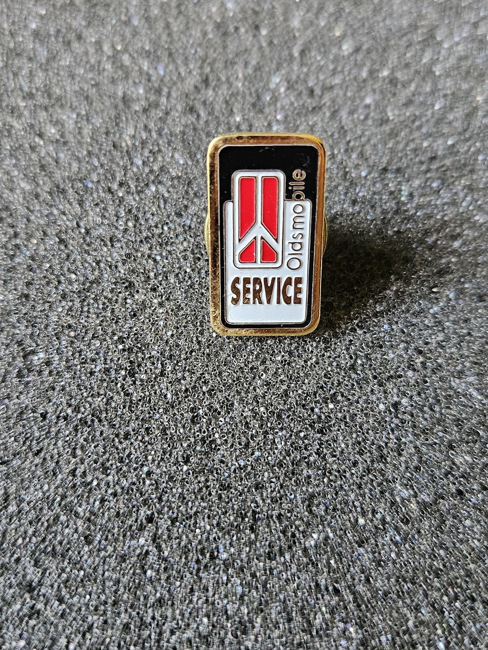 Vintage Oldsmobile Service Enamel Pin - Red, Black, White, Gold.